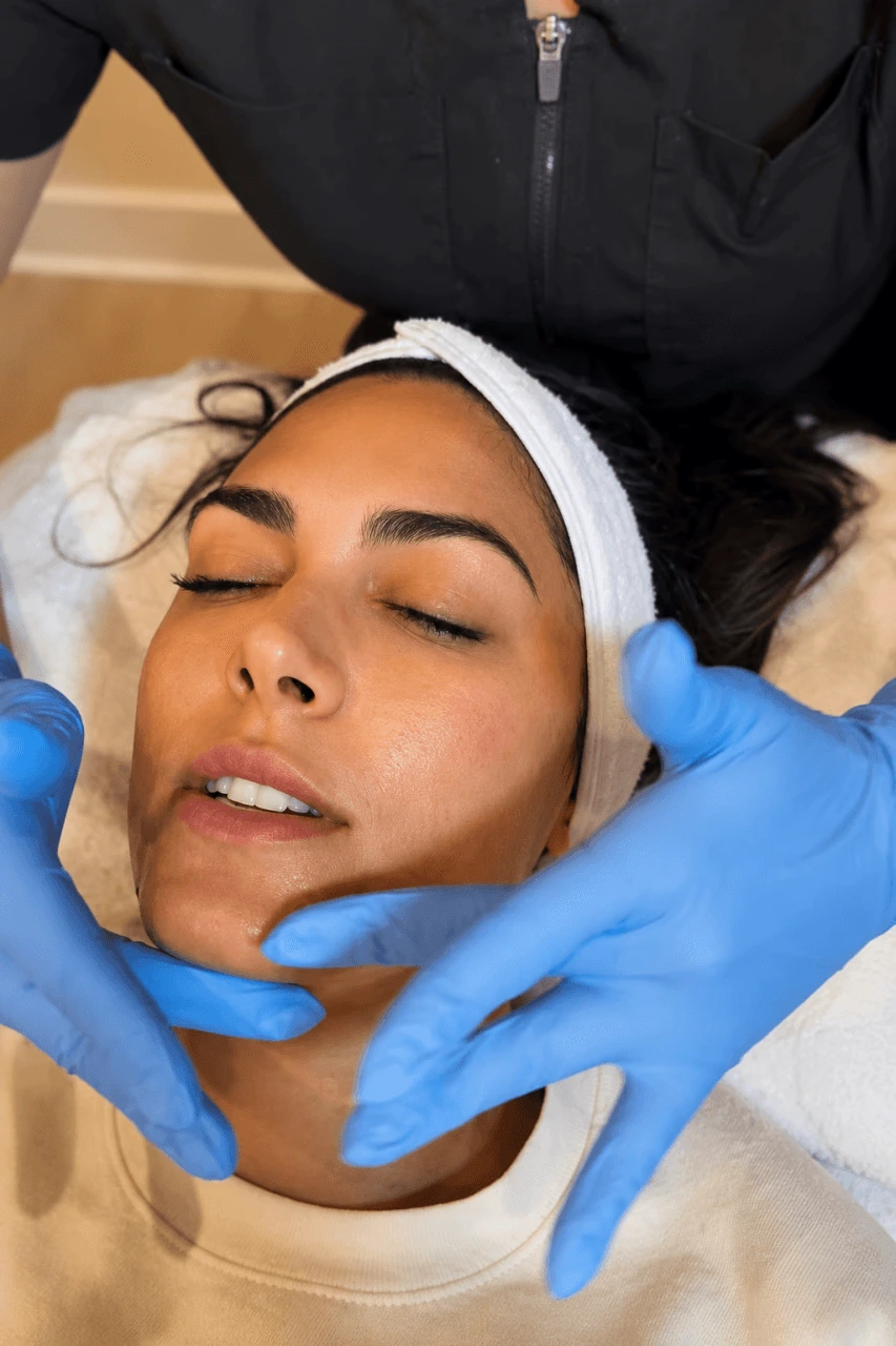 Woman receiving a facial treatment